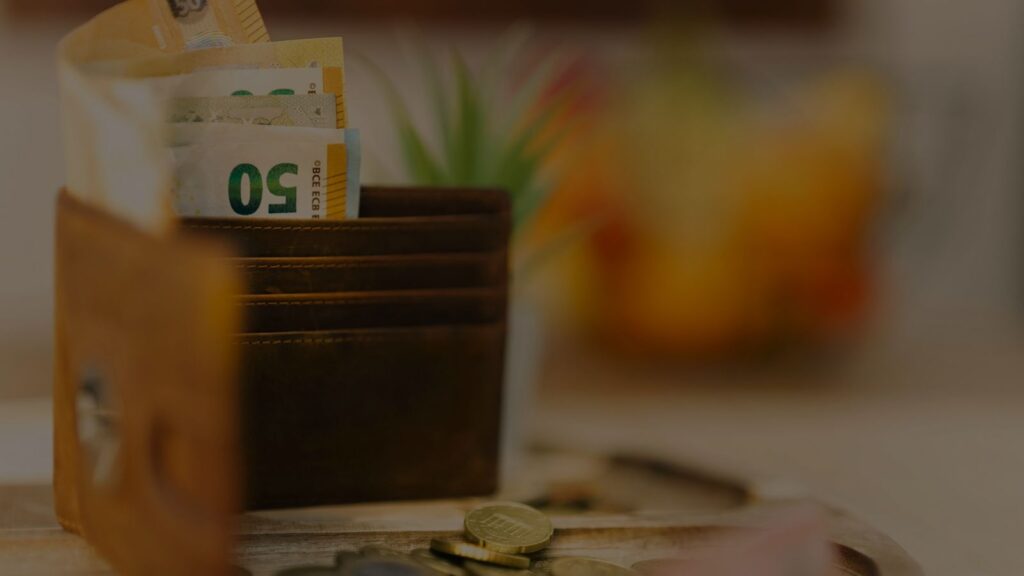 a photo of a wallet and a money