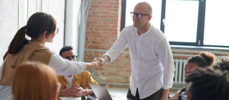 handshake over a tax form