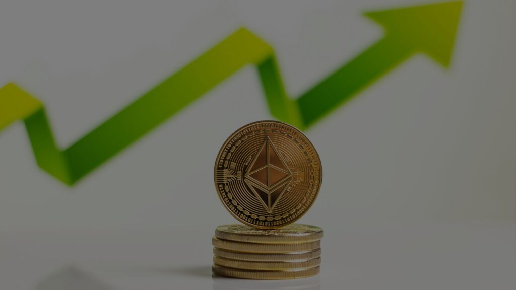 a photo of an arrow going up and a gold coin
