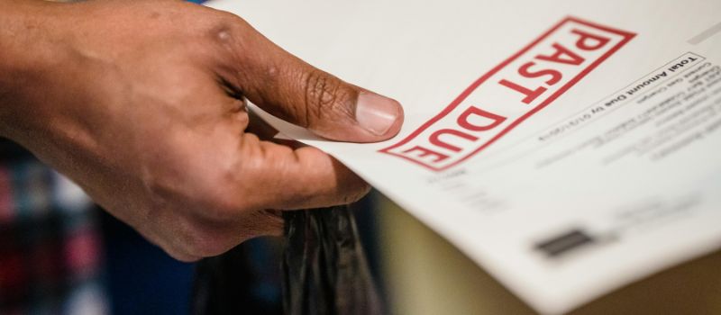 a person holding a past due billing