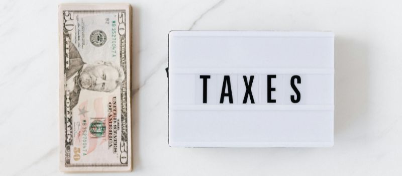 a photo of money with tax