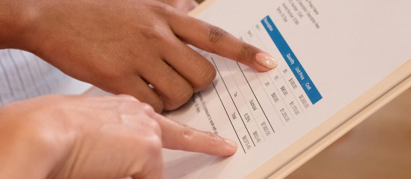 carefully checking the invoice