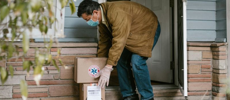 a photo of a person putting down some package