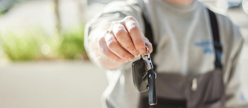 a man giving keys