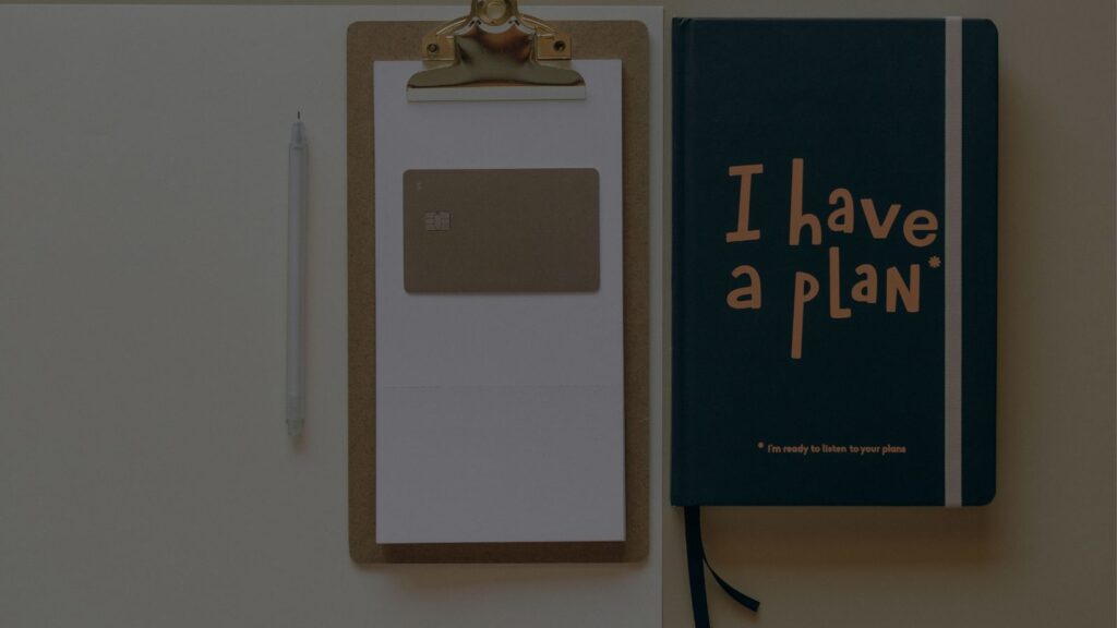 planner and notebook with i have a plan written on it