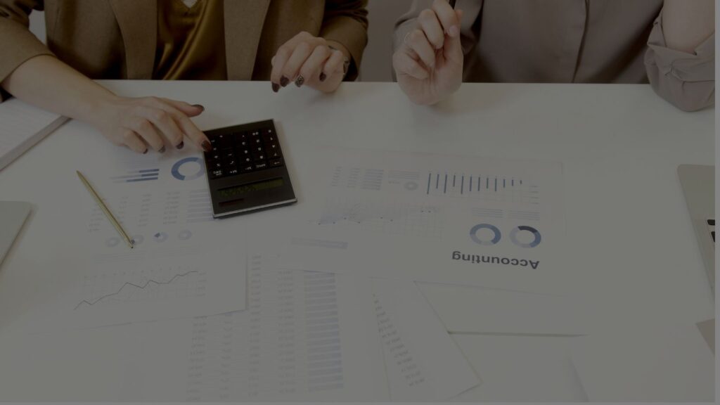 a photo of 2 person doing audit