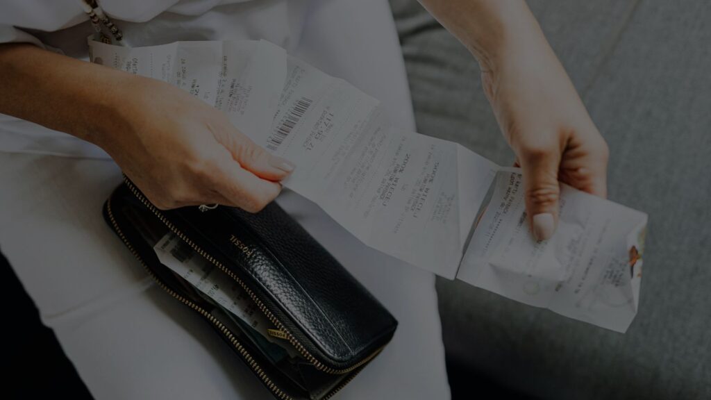 an image of a person holding a reciept