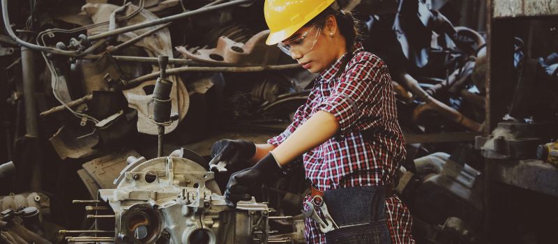 photo of a technician repairing some engine