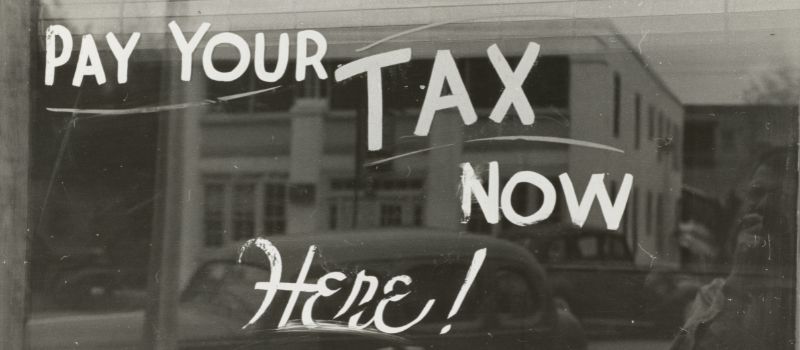 a photo of pay your tax now written