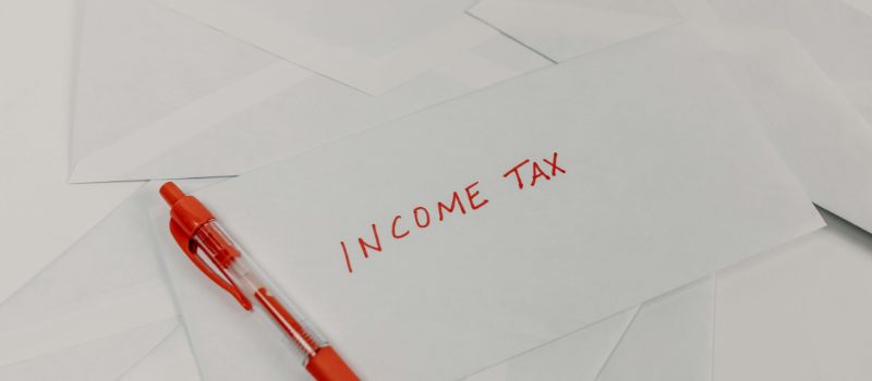 a photo of income tax written on it