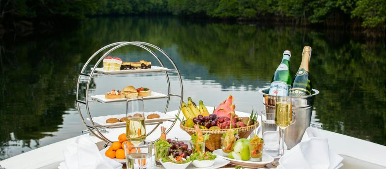 a photo of food and drinks in the table with a beautiful background