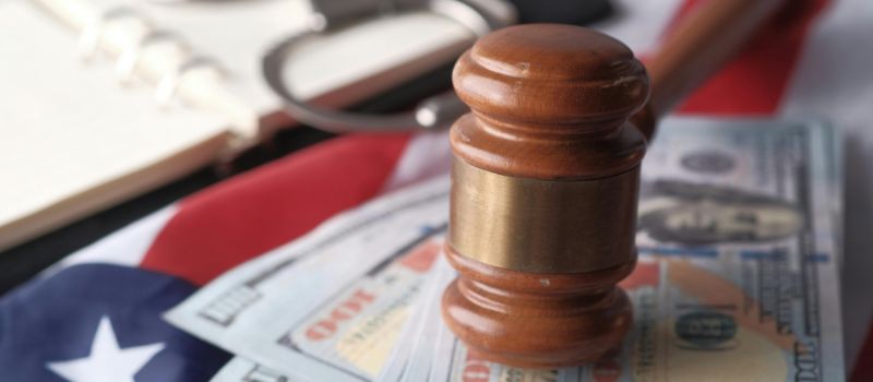 gavel and money in one photo