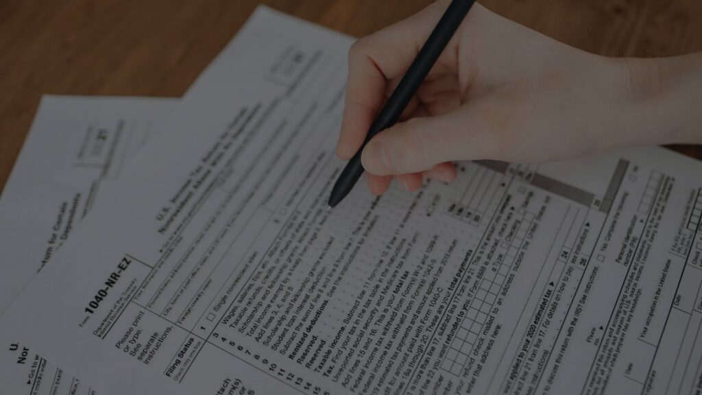 Close-up of tax forms and pen