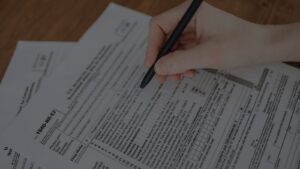 Close-up of tax forms and pen