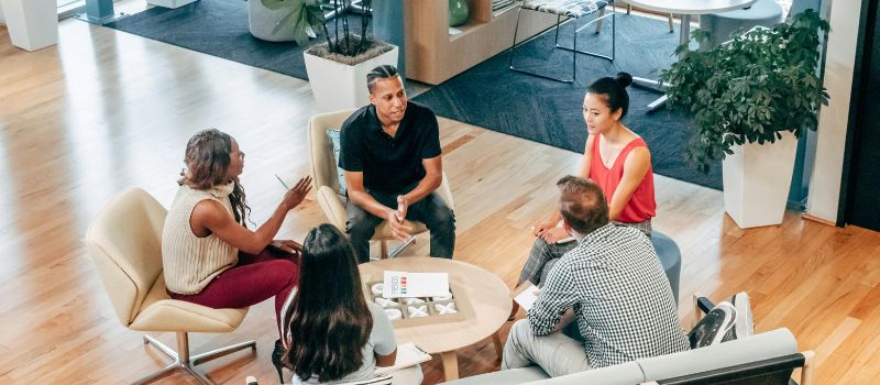 a group of people discussing some important topic