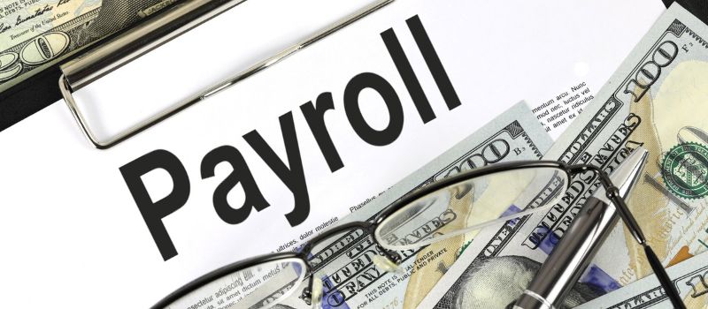 an image of a money and a word payroll written