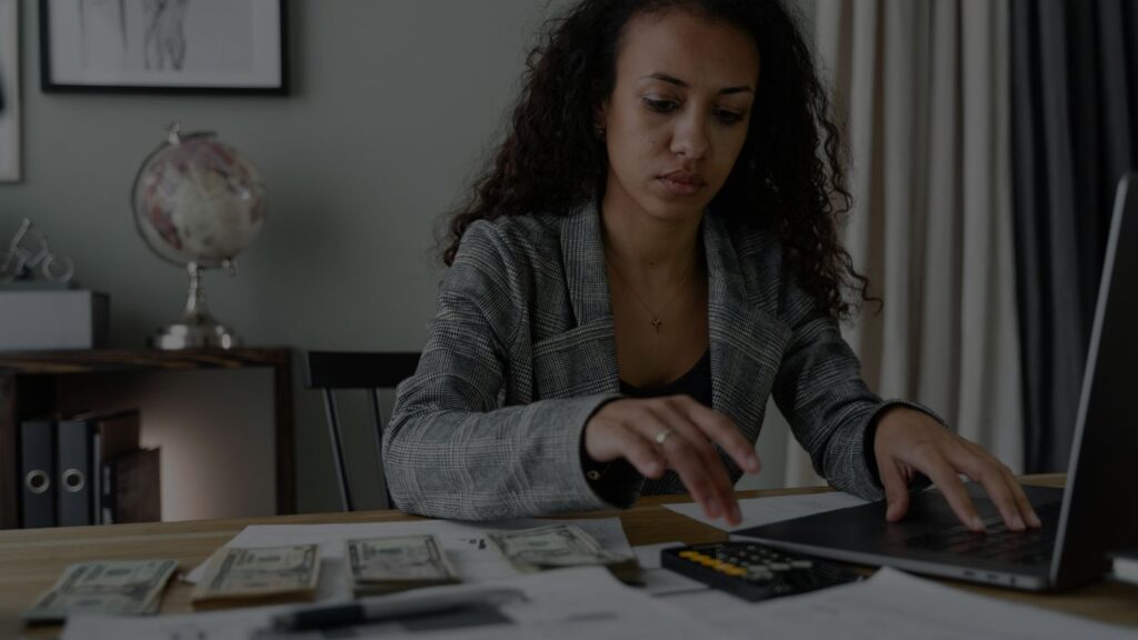an image of a person doing an audit and assesing all the documents