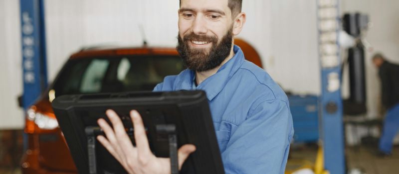 a mechanic looking at the screen
