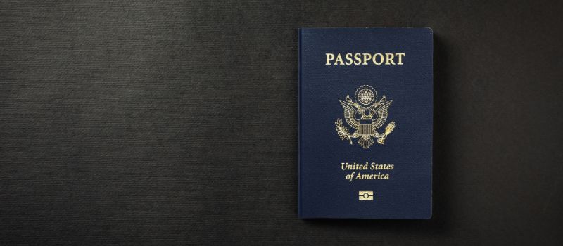 a blue passport with gold text