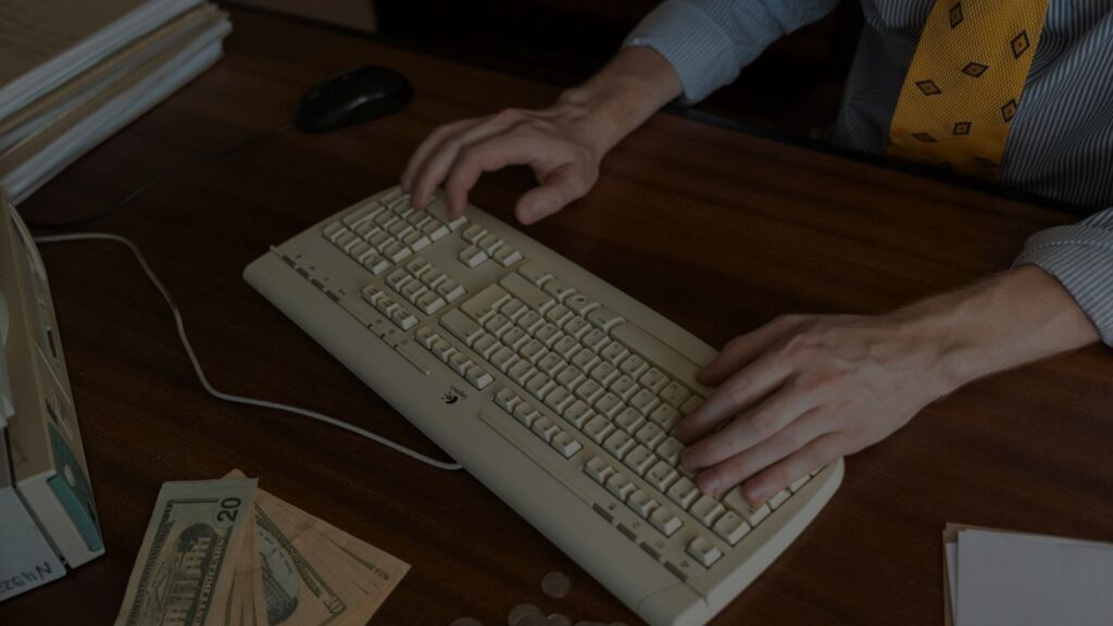 a person typing on a keyboard