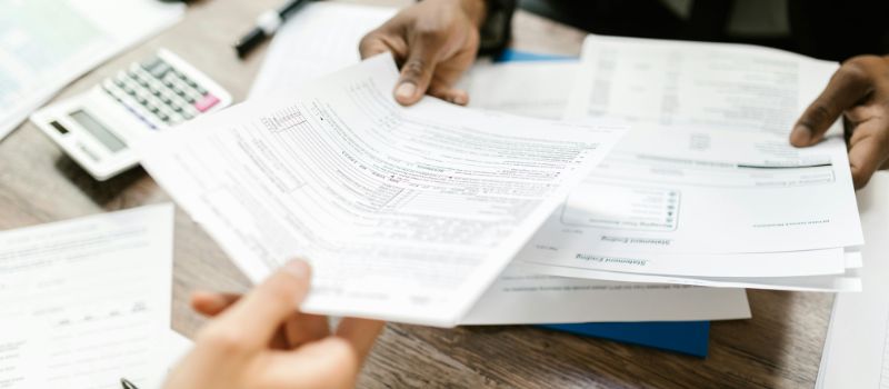 a person holding a paper