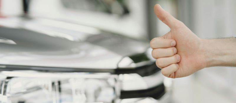 man doing thumbs up sign