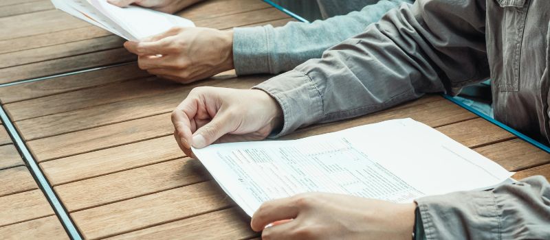 a person holding a piece of paper