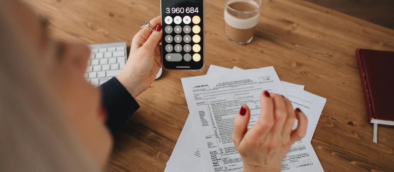 a person holding a calculator