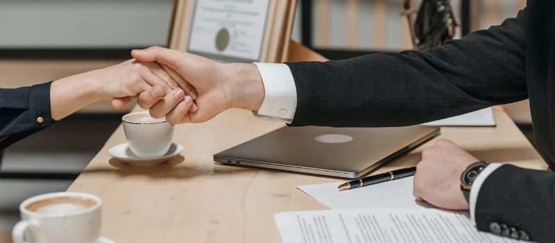 client-attorney hand shaking