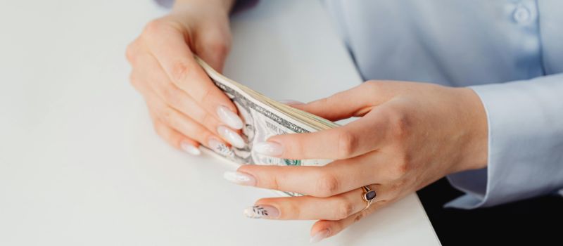 a person holding a money