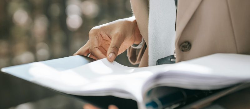 a person holding a files