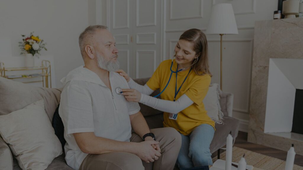 health aide assisting an elderly patient