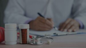 a professional doctor writing on the paper