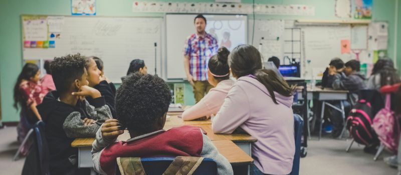 students listening to their teacher