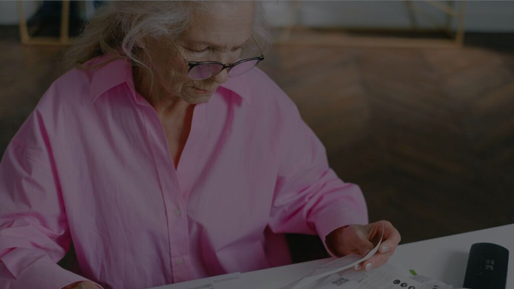 a person reviewing retirement account statements or bills