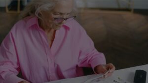 a person reviewing retirement account statements or bills