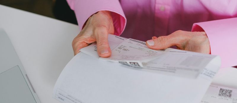 a person holding her documents
