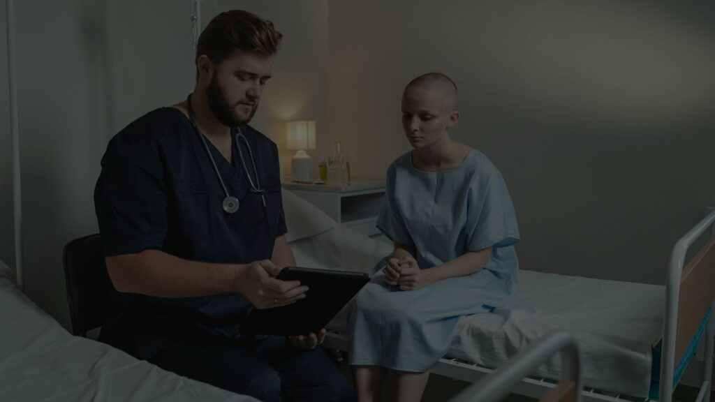 a clinician and patient reviewing medical charts together