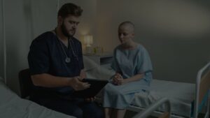 a clinician and patient reviewing medical charts together