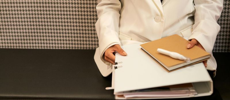 a person holding a folder