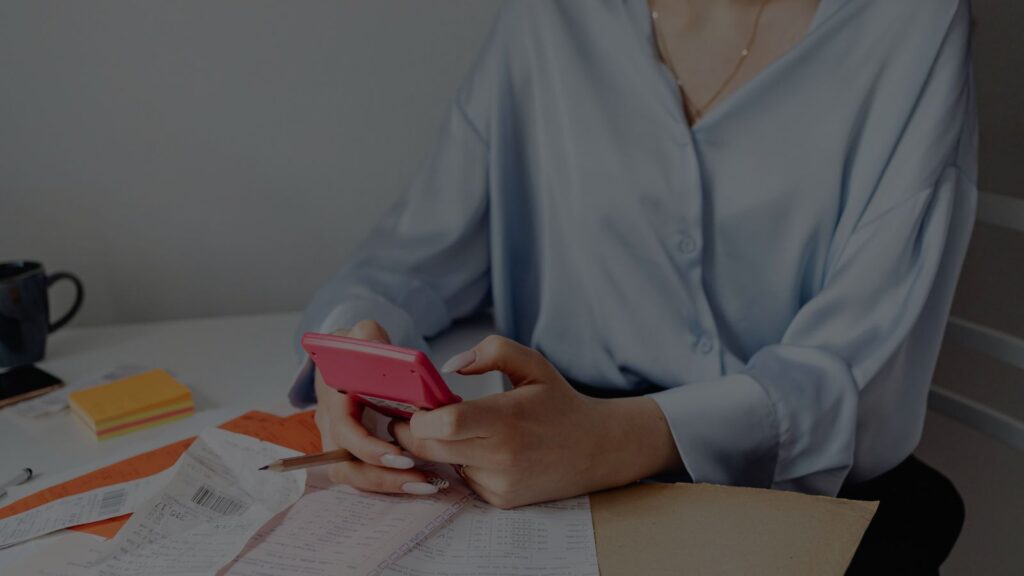 a person holding a calculator