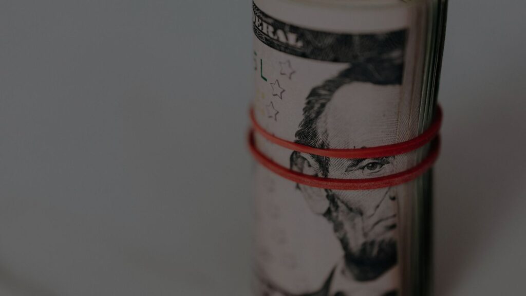 rolled-up money tied with a rubber band